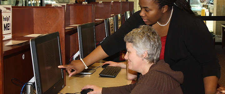 photo of two people at a computer