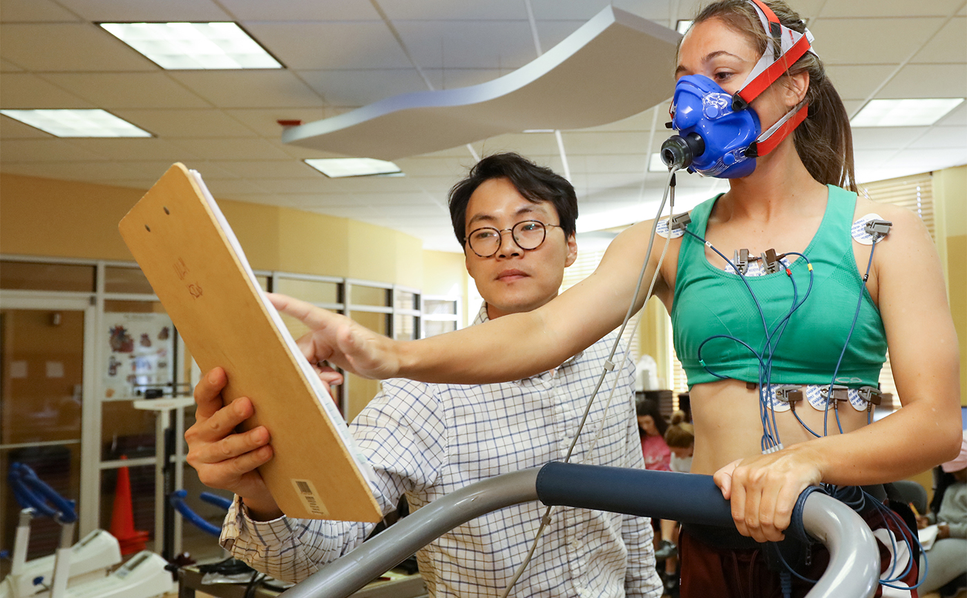 Kinesiology professor interacting with a student
