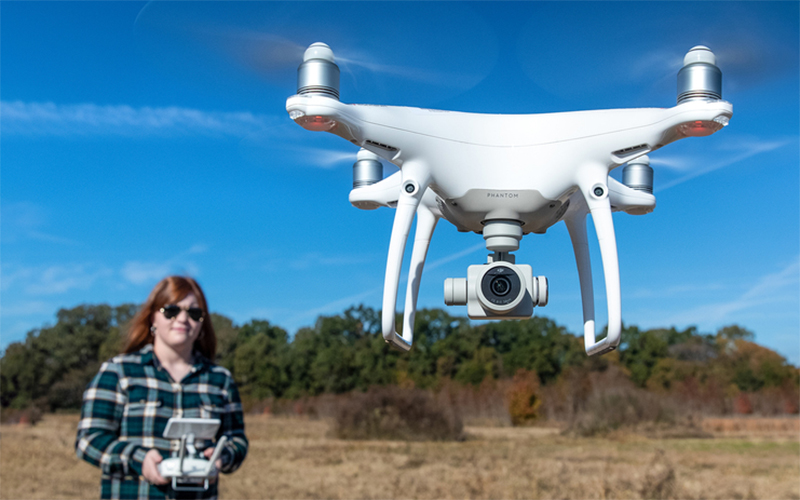 student operating a drone