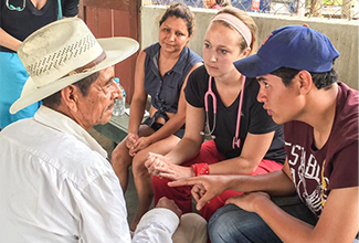photo of students talk to honduruns