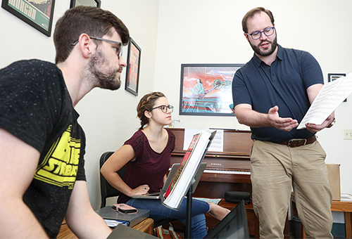 Music professor with students.