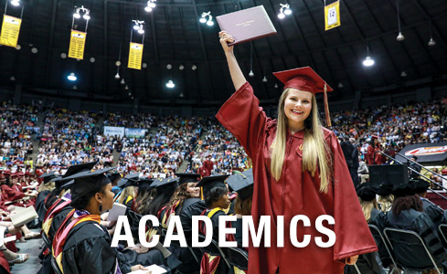 student celebrating at graduation