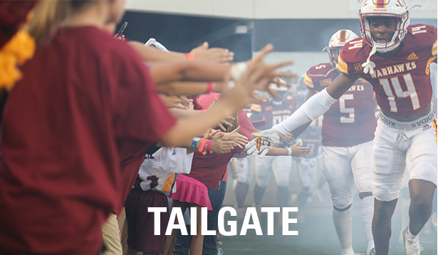 Photo of football team running on to the field