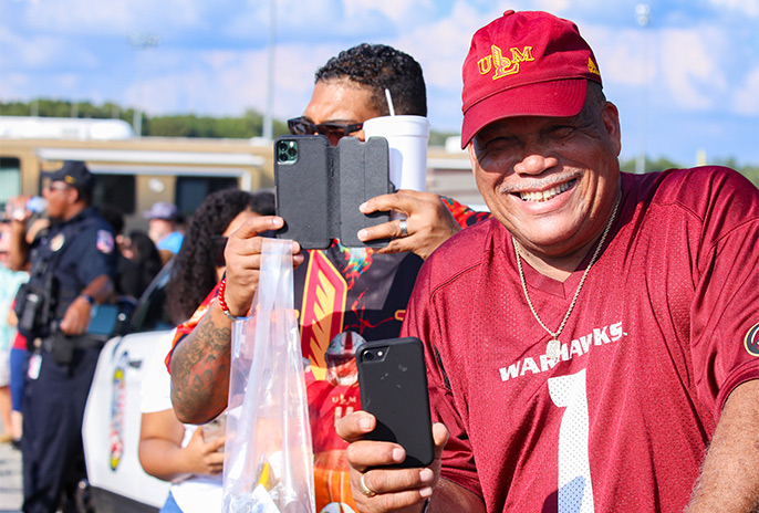 photo of smiling tailgate participant