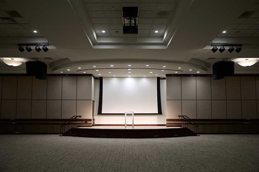 open auditorium with lights dimmed