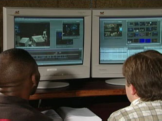 Two students in front of computers