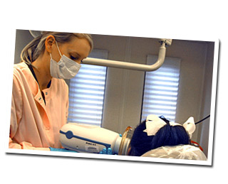 student and patient in dental clinic