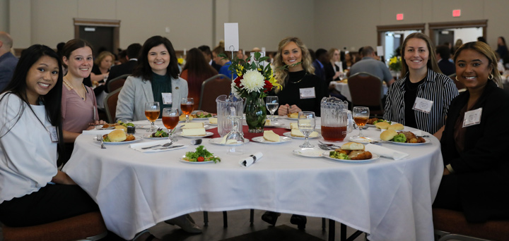 students at professional luncheon