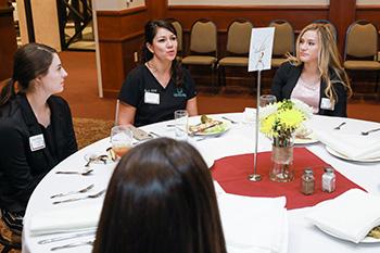 Luncheon participants enjoying conversation