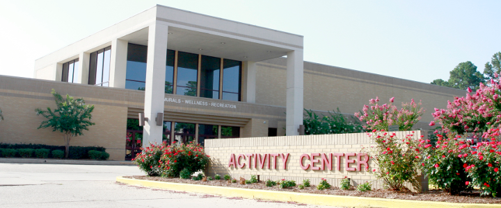Activity Center entrance from Warhawk Way, flowers in bloom