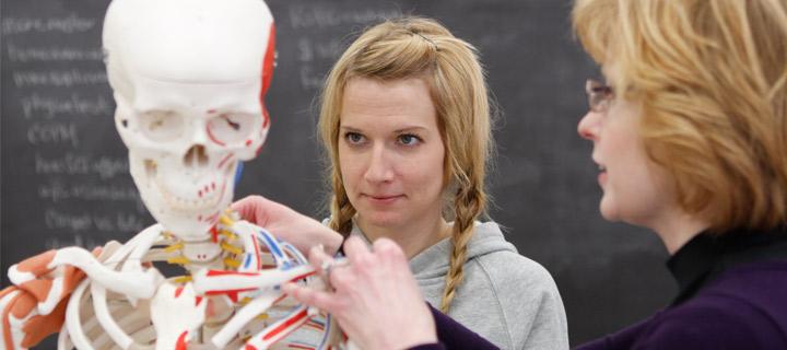 professor offering hands on instruction