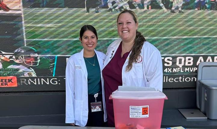 APhA students host the Main Campus Flu Clinic giving free immunizations to students and faculty outside the Hub.