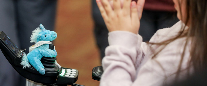 child's hands and toy