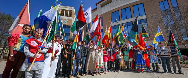 photo of international students with flags