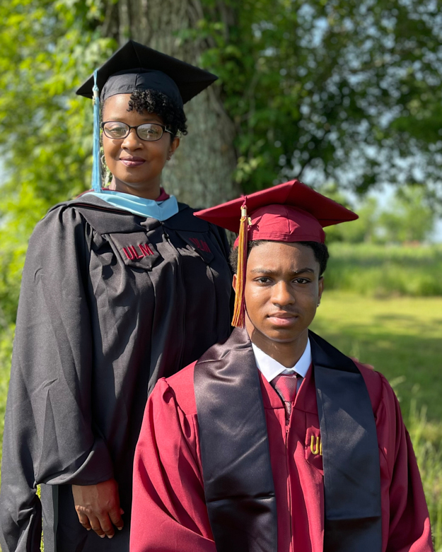 Krisha and Tavier Williams pose in their caps and gowns.