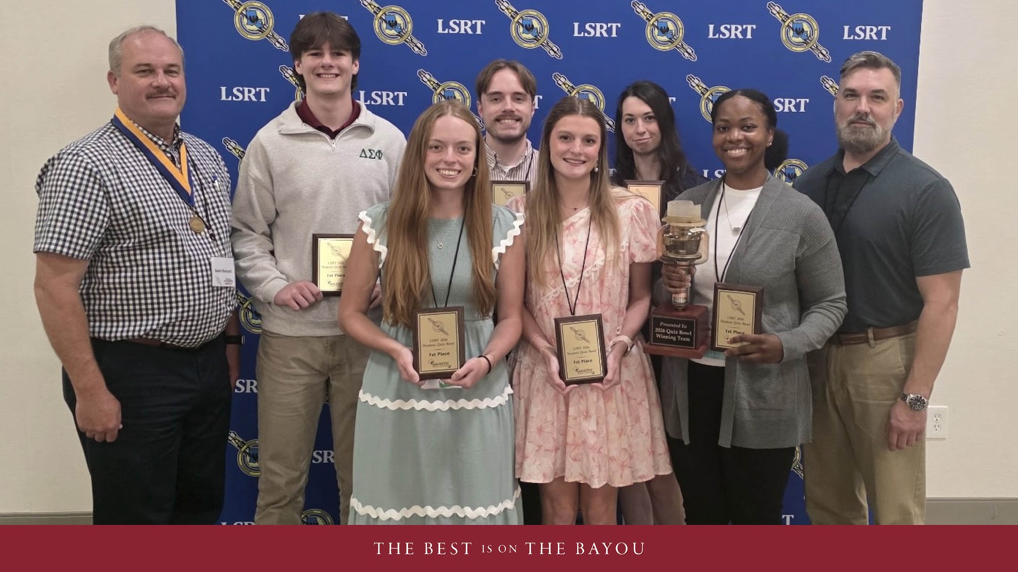 A group of radiologic technology faculty and staff pose with awards at a conference.