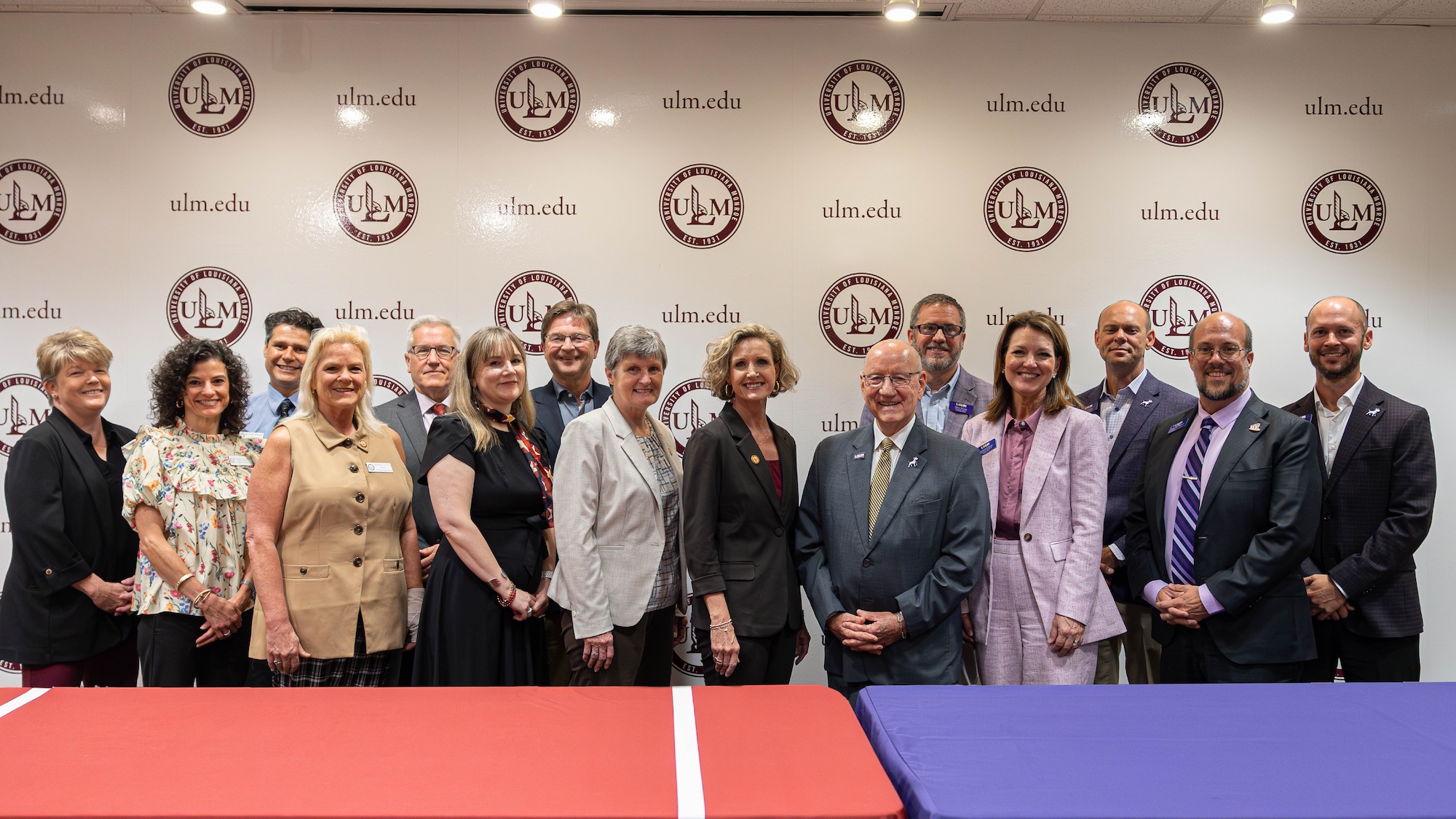 A large group of people from ULM and LSUA pose at the signing of an agreement. 