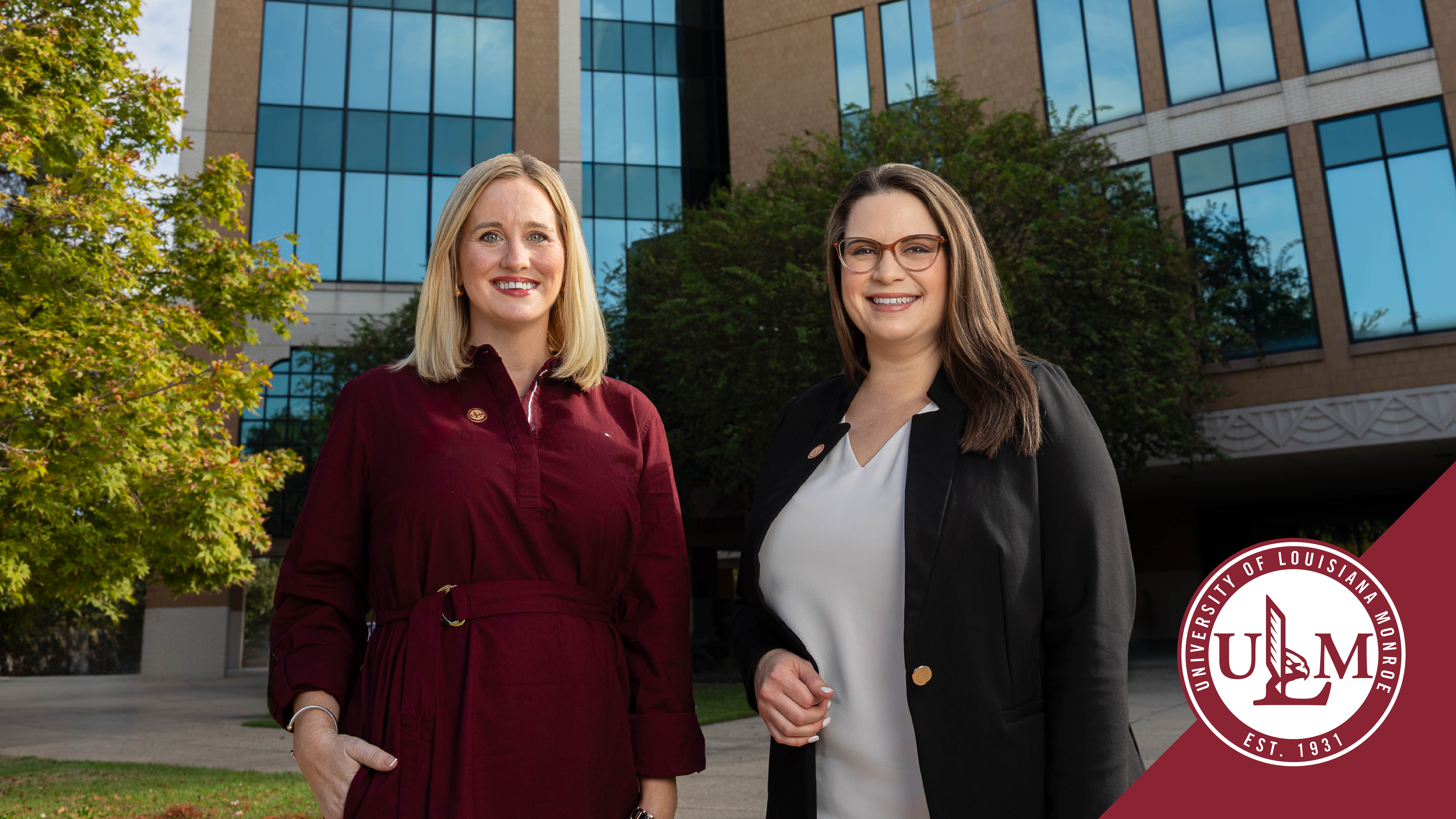 Meagan Morris and Jessica Zagorski pose outside the ULM Library.