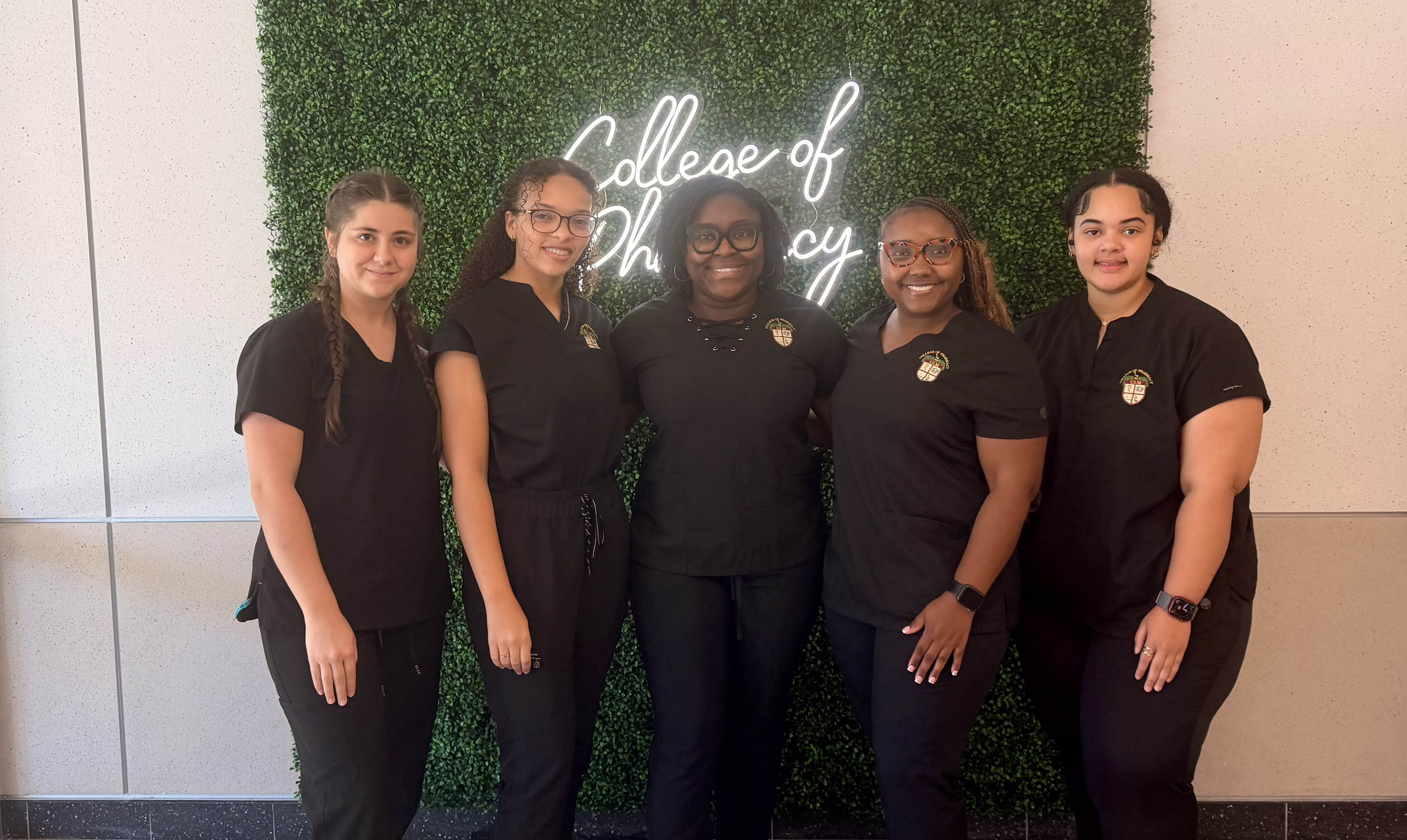 Five females in front of a green College of Pharmacy board. LIPA Executive Board 2026