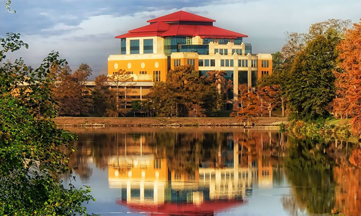 picture of library reflected in bayou