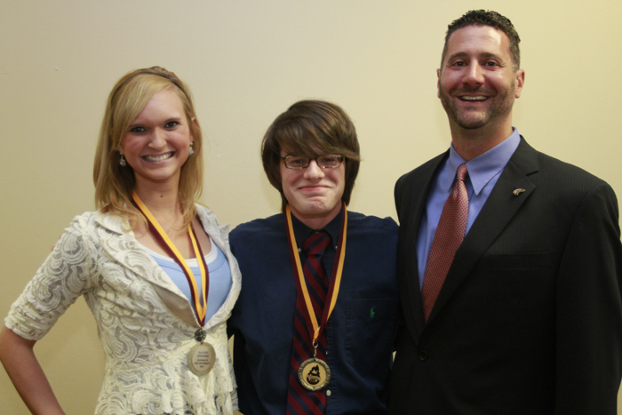 Dr. Stockley and students smiling