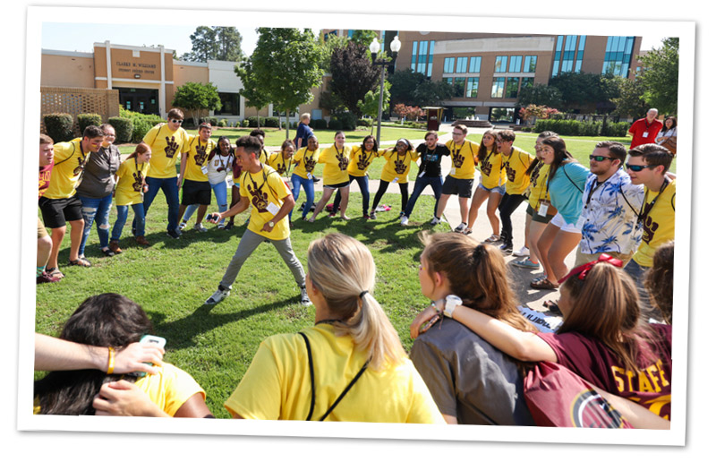 students in a circle cheering