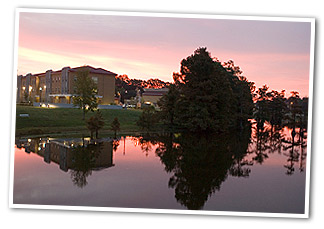 photo of dorm on the bayou at night