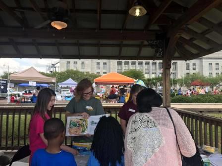 graduate students participating in a community activity